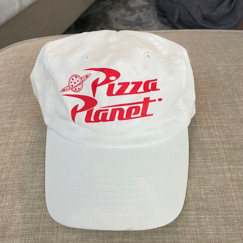 Disney pizza planet white baseball cap.